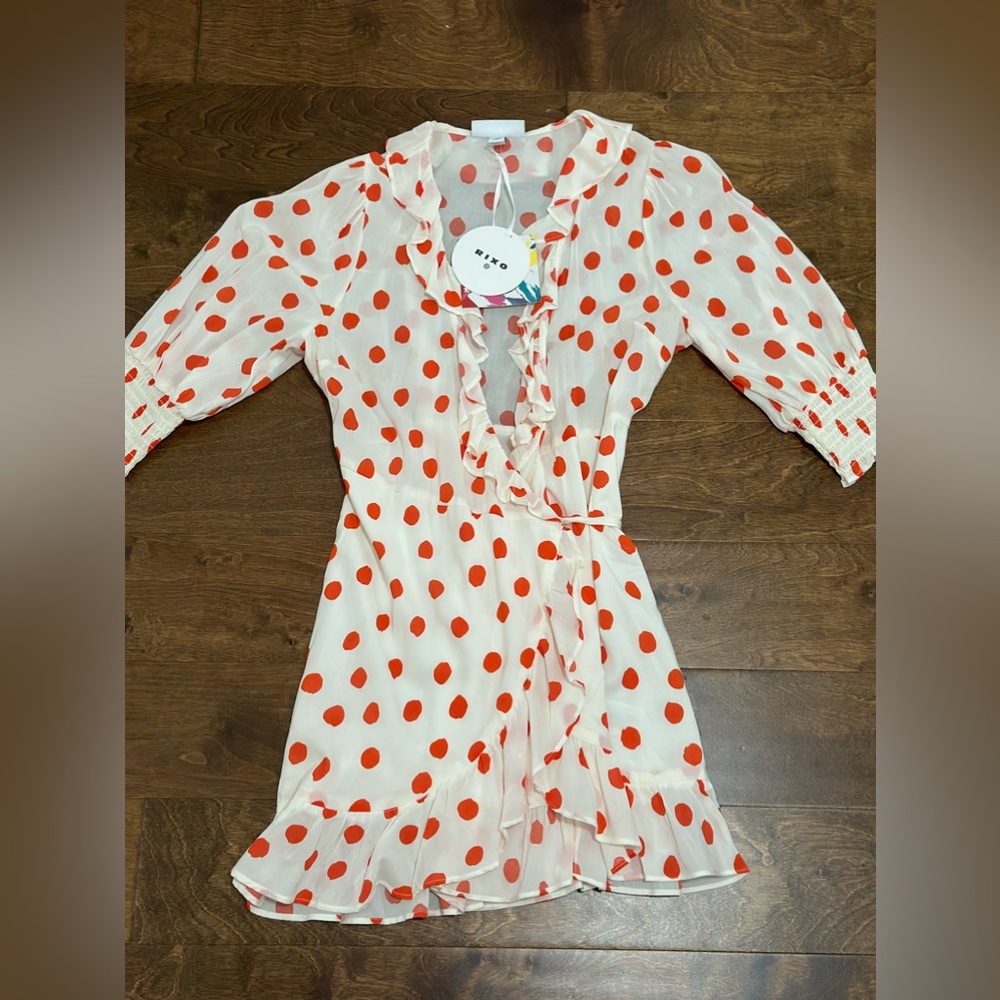 Wrap dress with ruffled edges